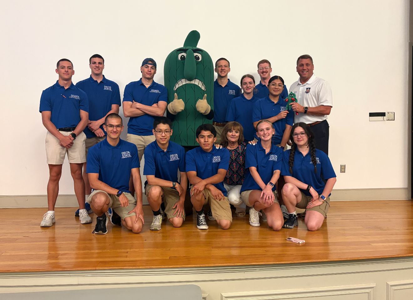 a group of students with the DSU Okra mascot