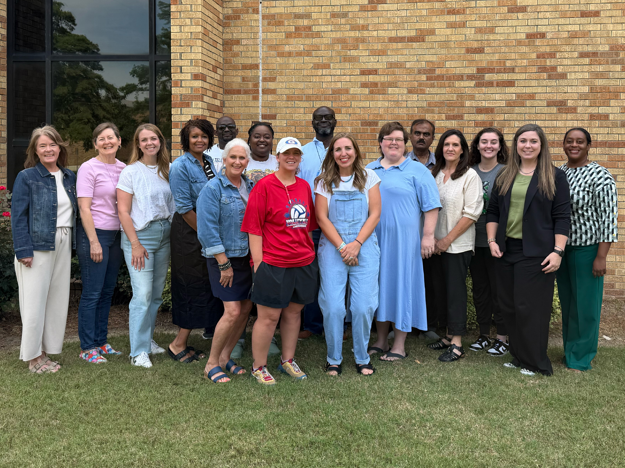 a group of educators standing outside Caylor-Walters Hall