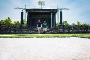 Delta State staff and students preparing for outdoor concert.