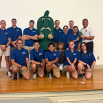 a group of students with the DSU Okra mascot
